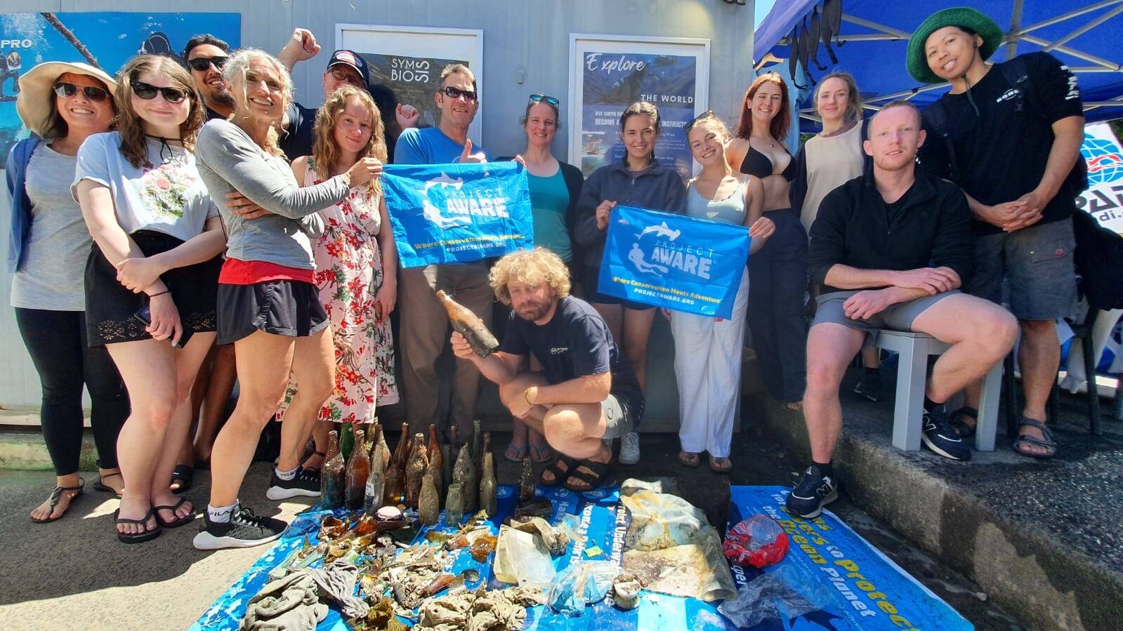 Divers with debris collected after a PADI ocean clean-up dive in Sydney